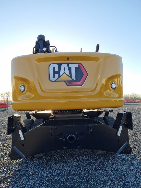 Rear view of a Caterpillar Material Handler with 4 outriggers