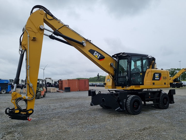 2020 refurbished, cleaned and painted Caterpillar MH 3024 material handling machine with bucket linkage on solid tires