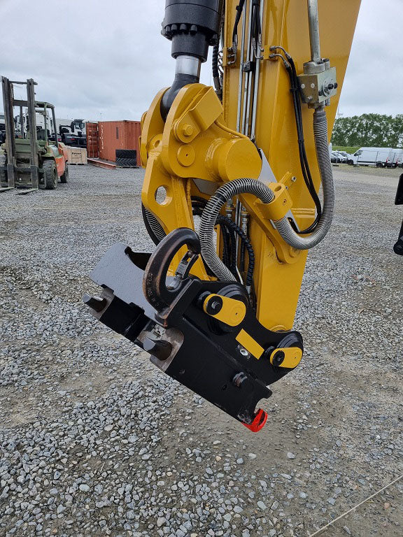 Bucket linkage up close on a caterpillar material handling machine