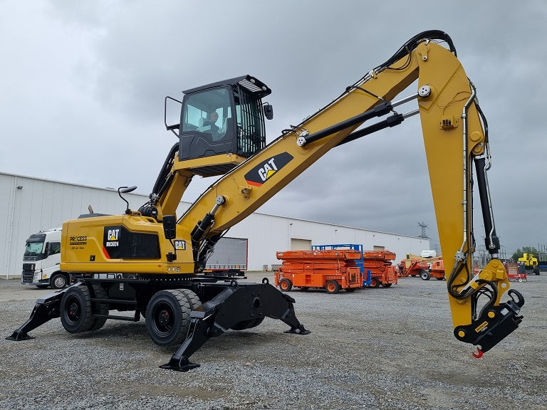 Caterpillar MH 3024 material handler with bucket linkage, hydraulic elevating cab with FOPS and ROPS guards