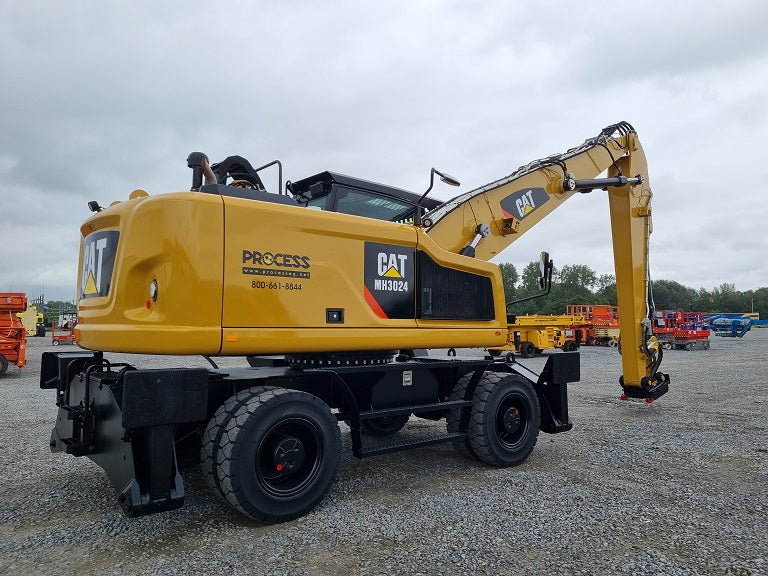 Refurbished Caterpillar material handling machine on solid rubber tires with bucket linkage