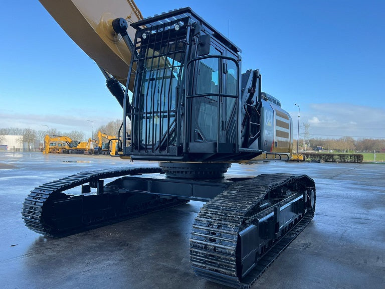 Caterpillar MH 336 Material Handler with front cab guard, heavy duty wide variable gauge undercarriage, 24" track shoes, full length track guard