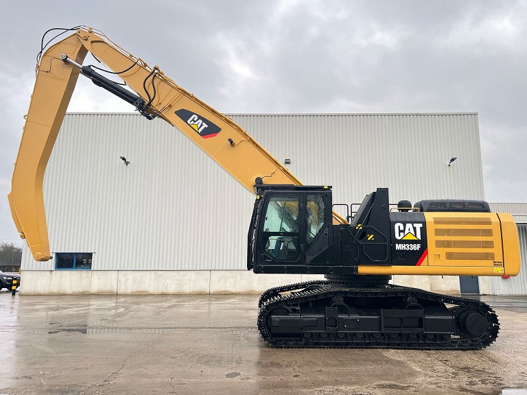 Caterpillar Material Handler model MH336F on tracks with a 52' front
