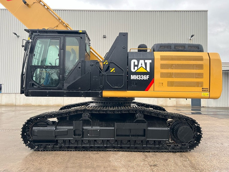 Refurbished, cleaned and painted Caterpillar Material Handler on tracks