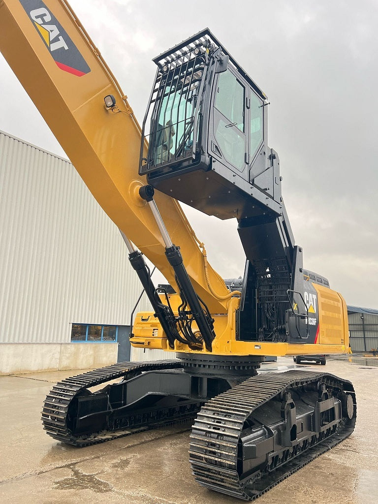 Caterpillar material handler with elevated cab and cab guards