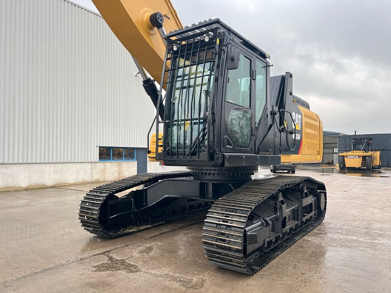 Caterpillar Material Handler with a front cab guard on tracks