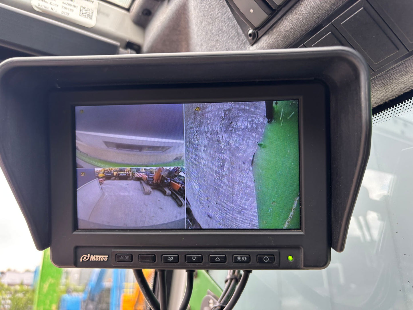 Monitor displaying a rearview camera view inside a Sennebogen 850 material handler
