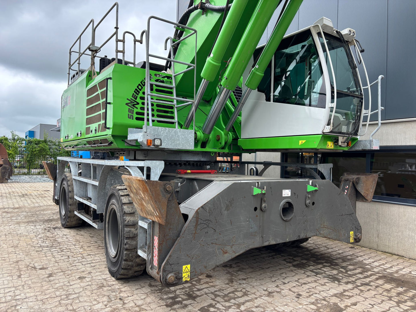 Sennebogen 850M E Material Handler with railings and a cab on wheels
