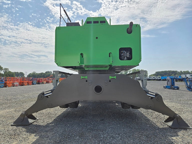 Back side of Sennebogen material handler 855M Hybrid with outriggers on sold tires