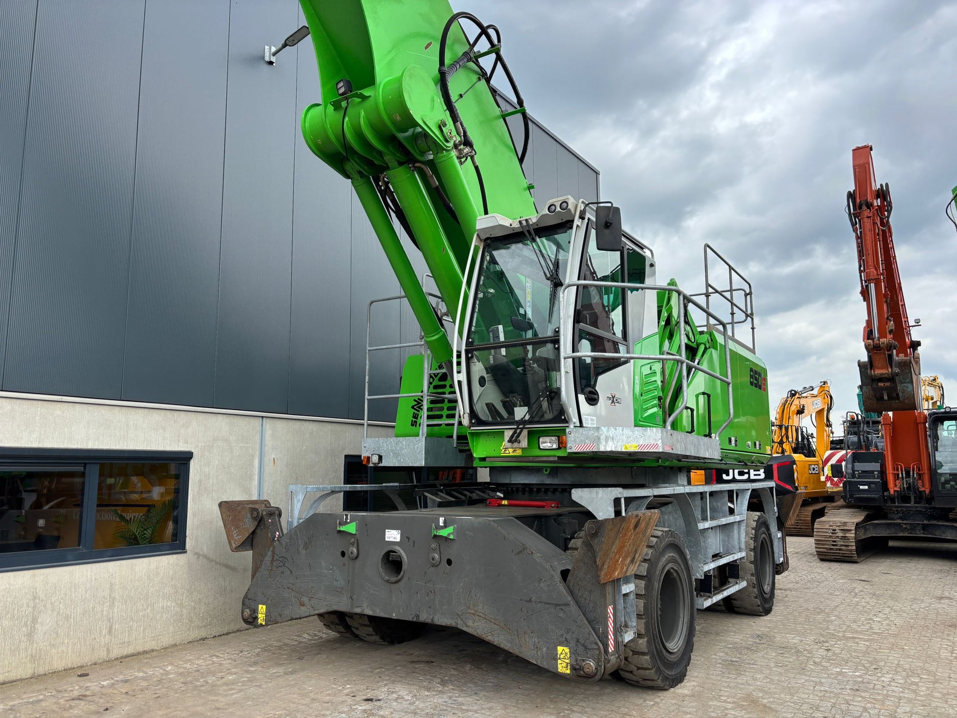 Sennebogen material handling machine with operators landing